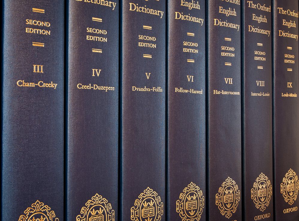 Oxford English Dictionary, printed dictionaries, row of hardcover books