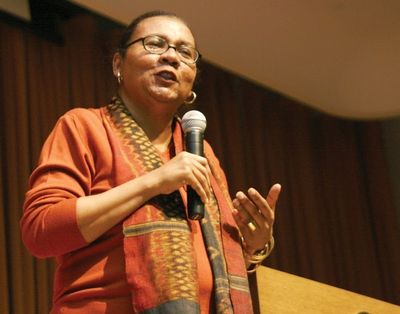 bell hooks speaking into a microphone at an event, November 1, 2009.jpg