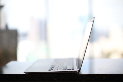 Side-view-of-laptop-on-table.jpg