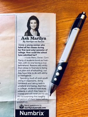 Photo of a short article in a paper magazine with a pen resting next to it.jpg