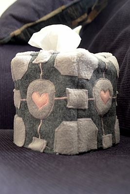 Tissue box in a grey fleece cover with pink hearts sewn on.jpg