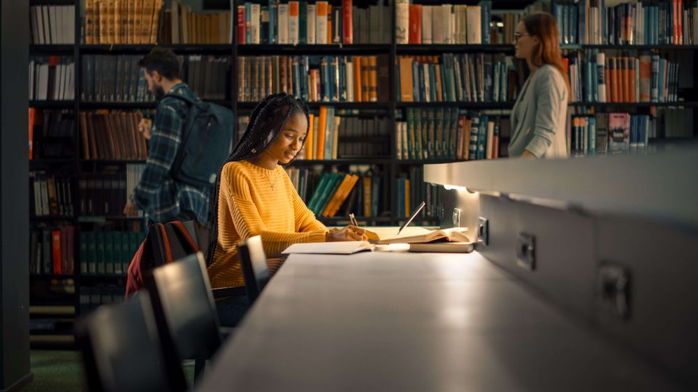 A female student studies in the library