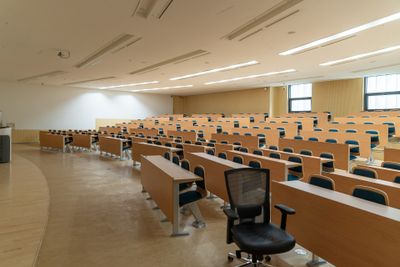 A picture of an empty lecture hall. Photo by Changbok Ko on Unsplash