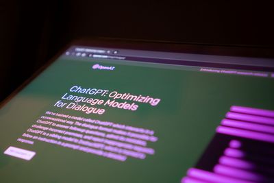 Close-up of computer screen open to OpenAI's website describing ChatGPT functionality.jpg