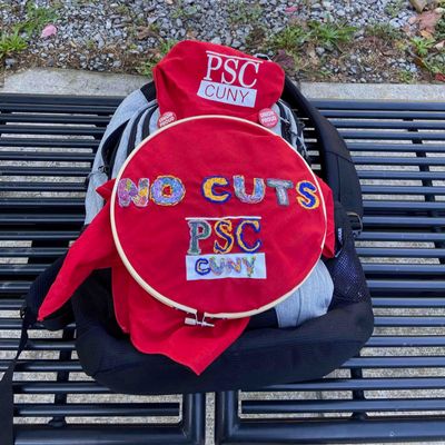 Embroidered banner for Union Week:  NO CUTS PSC CUNY