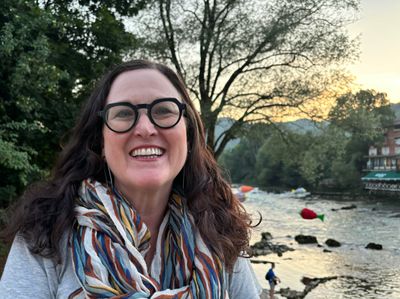 Dr. Susan Nolan on the terrace outside her house in Banja Luka, overlooking the Vrbas River in Bosnia and Herzegovina.