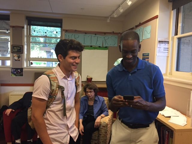 Edan Armas and Mark Otuteye, spoken word poets, performing at the Hume Center