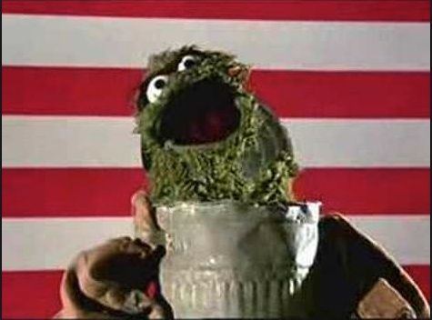 Oscar the grouch singing from trash can the grouch anthem, american flag in background